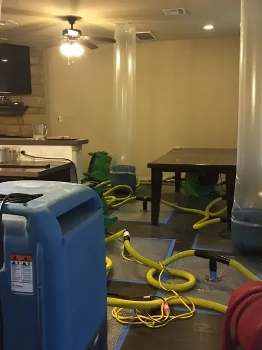 Truck-mounted extraction equipment staged at a water damage job